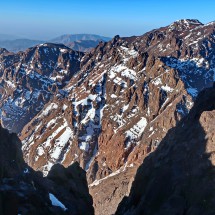 Close to the summit of Toubkal West with Timesguida and Ras Ouanoukrim on the top right